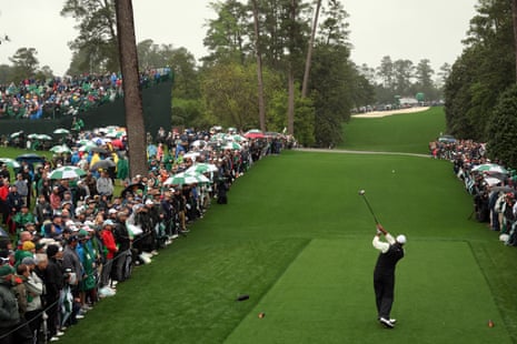 Tiger Woods plays his shot from the 18th tee during the continuation of the weather delayed second round of the 2023 Masters Tournament.