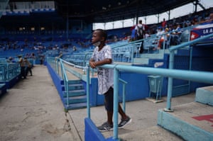 A child watches a baseball match between Industriales and Artemisa at the Latinoamericano stadium
