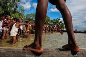 People gather to receive aid at Guthail, Jamalpur, Bangladesh.