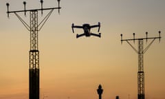A drone flying near an airport runway. Photograph: Alexandre Rotenberg/Alamy