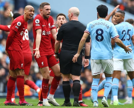 Liverpool's Jordan Henderson, Diogo Jota and Fabinho remonstrate with referee Simon Hooper.