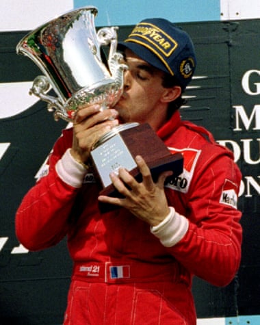 Jean Alesi kisses the trophy after winning the 1995 Canadian Grand Prix