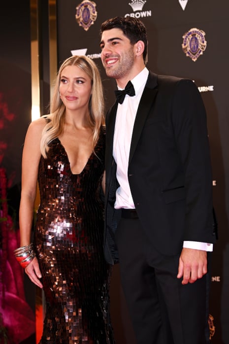 Bella Beischer and Christian Petracca of the Melbourne Demons pose on the red carpet.