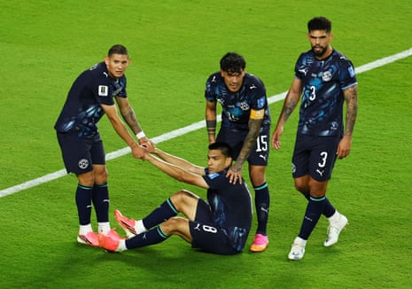 Paraguay's Diego Gomez reacts with Gustavo Gomez and teammates.