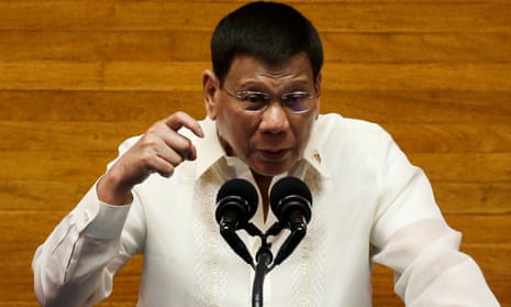 Rodrigo Duterte gestures as he delivers his sixth state of the nation address in Quezon City, Metro Manila