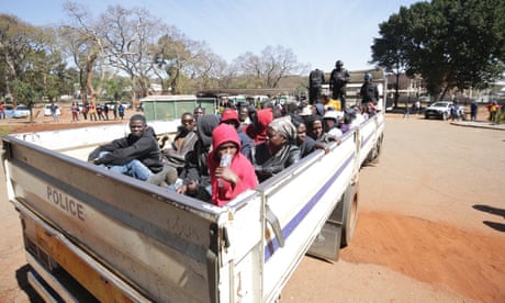 A police truck containing 40 arrested opposition Citizens Coalition for Change members arrives at the Harare magistrates court in Harare, Zimbabwe.