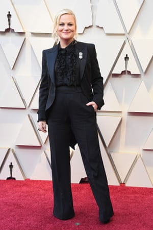 Amy Poehler wore a black Alberta Ferretti tuxedo, replete with tails and a sheer ruffle blouse – prompting a flurry of Twitter proposals (and a few Leslie Knope comparisons) as she was joined on the red carpet by pals Tina Fey and Maya Rudolph.