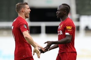Liverpool’s Sadio Mane is congratulated by James Milner after scoring.