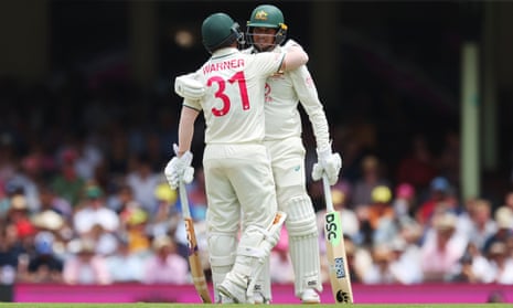 Australia openers David Warner and Usman Khawaja embrace after reaching 50 runs against Pakistan on day two of the third Test
