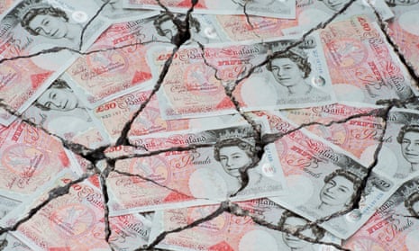 Cracked fifty pound notes concept to represent an economic crisis