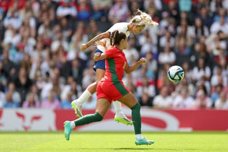 Daly heads the ball under pressure from Gomes.