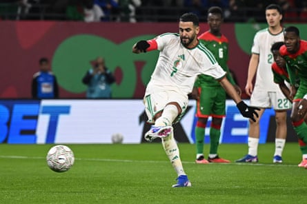 Riyad Mahrez scores from the penalty spot for Algeria