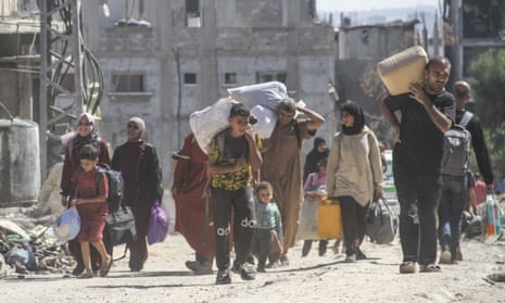 Palestinians walk during evacuations of Jabalia refugee camp and the Sheikh Radwan and Abu Iskandar neighbourhoods in northern Gaza last weekend