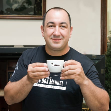 Rayco Rodriguez, owner of El Cafe de Don Manuel, which as won several awards for its coffee, holds up a cup of espresso.