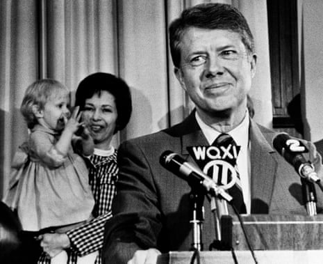 Jimmy Carter in Atlanta in 1970, announcing his candidacy or governor. In background, his wife Rosalynn holds two-year-old daughter Amy.