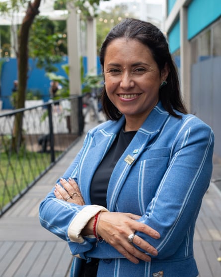A middle-aged Latina woman in a jacket