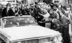Crowds mob the car carrying the Beatles from Adelaide airport to the city centre