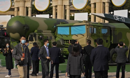 Visitors tour past military vehicles carrying ballistic missiles at an October exhibition in Beijing highlighting Xi Jinping and China’s achievements under his leadership