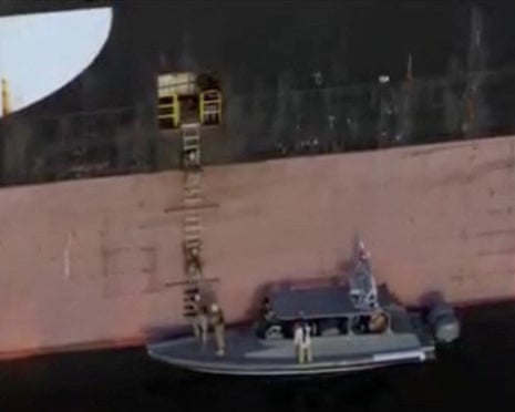 A screen shot from a video said to show Iranian forces during the operation seizing the container ships MSC Francesca and Epaminondas in the strait of Hormuz, as broadcast on Iranian state TV