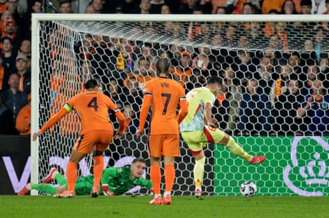 Spain's Mikel Merino scores their second goal.