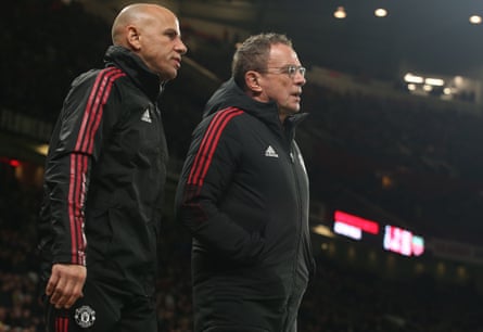 Interim Manager Ralf Rangnick and Coach Chris Armas of Manchester United walk out for the second half during the Emirates FA Cup Third Round match between Manchester United and Aston Villa at Old Trafford on January 10, 2022 in Manchester, England.