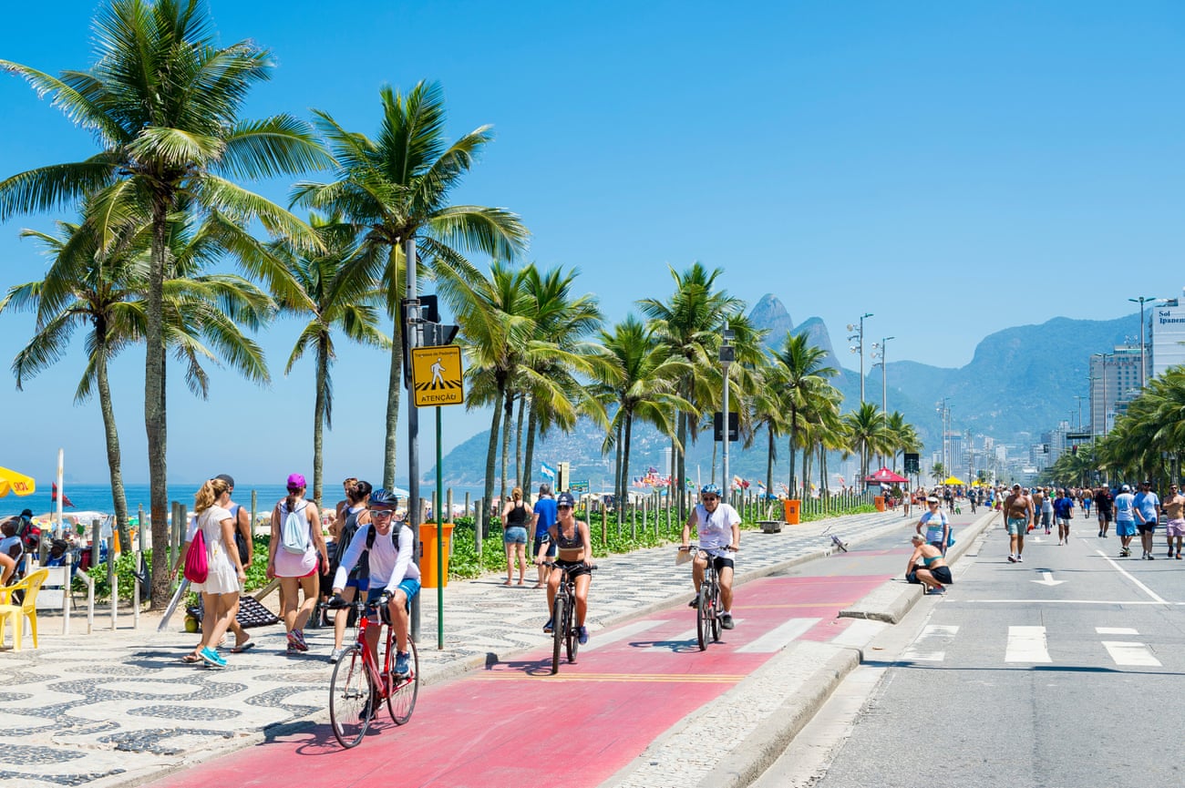 Cyclists in the bike lane next to the Ipanema Beach, Rio