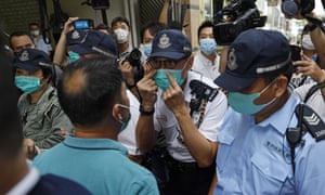 Police confront members of the Democratic party during a recent protest in Hong Kong.