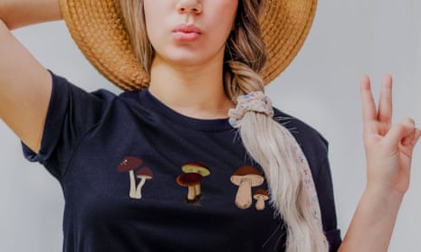 A T-shirt with mushrooms on the front, in goblincore style