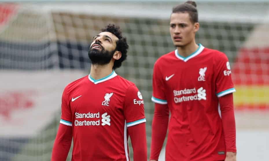 Liverpool's Mohamed Salah and Rhys Williams react after Fulham's Mario Lemina scored at Anfield