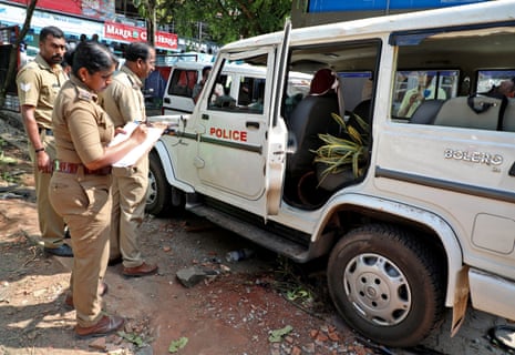 Police on Monday examine a vehicle that was damaged during a clash with protesters at a police station near Adani’s proposed Vizhinjam port in the southern state of Kerala, India.
