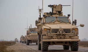 A convoy of US-led international coalition troops in the Deir ez-Zor province, Syria.