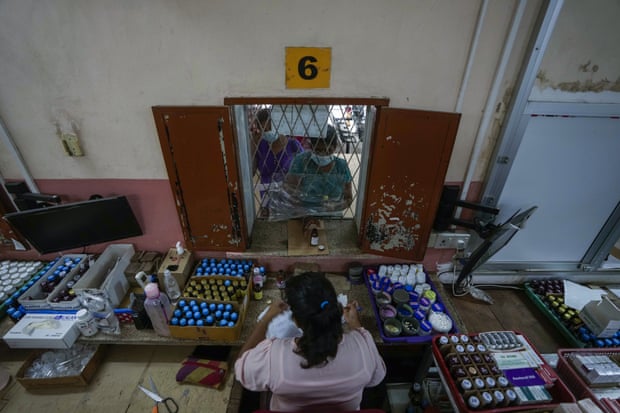 People queue at a dispensary at a government-run hospital in Colombo.