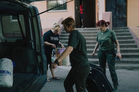 Olena, 48, leaves her home in Pokrovsk. Her son Danil, 25, works in a nearby mine and his staying.