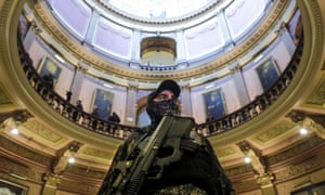 An armed protester at the Michigan Capitol Building in Lansing, 30 April 2020. Protesters demanded that the state not extend Governor Gretchen Whitmer's stay-at-home order.