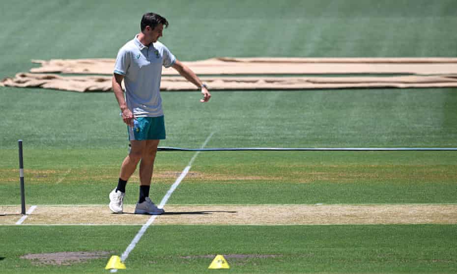 Australian captain Pat Cummins inspects the pitch at the Adelaide Oval the day before the second Test