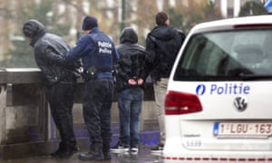 Police detaining a man in Brussels