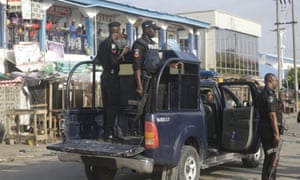 Police officers patrol near the Lekki toll gate in Lagos, Nigeria
