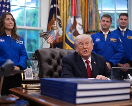 Donald Trump takes questions from the media during an event with the Artemis II astronauts in the Oval Office.