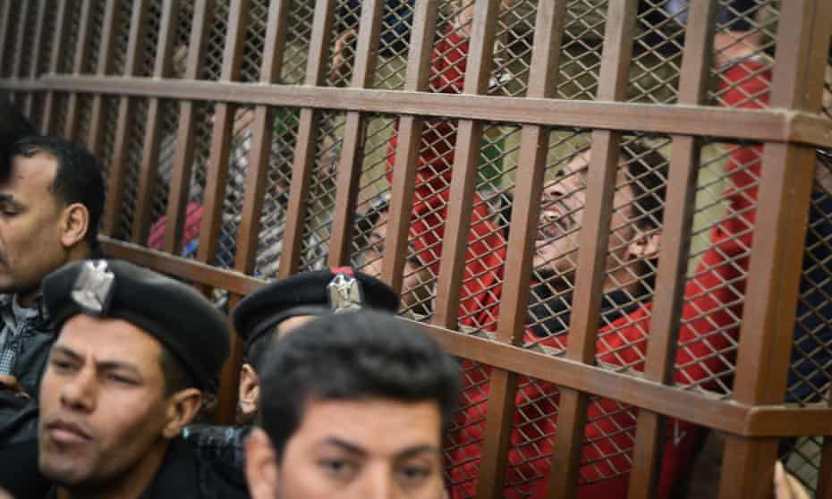 2015: Defendants react behind the bars at a court in Cairo following the acquittal on January 12, 2015 of 26 male men accused of “debauchery” after they were arrested in a night-time raid on a bathhouse in the Egyptian capital last month that triggered international concern. 