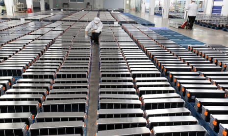 A worker inspects lithium-ioncar batteries at a factory in Nanjing in China.