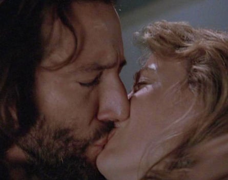 The couple kiss passionately