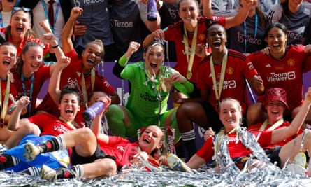 Mary Earps and Ella Toone celebrate victory with their Manchester United teammates