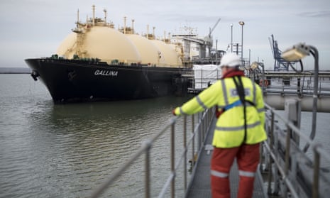 An employee looks towards the Gallina liquefied natural gas tanker after docking at National Grid’s Grain plant on the Isle of Grain in Rochester.