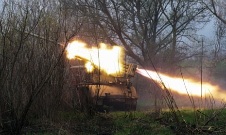 Ukrainian service personnel firing a multiple rocket launcher from their position in the Kharkiv area.
