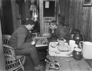 A Game Of Chess, May 1915Frank Hurley (left) and Leonard Hussey (right) playing chess and eating sardines during their Night Watch.