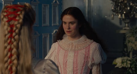 a woman in a pink and white dress