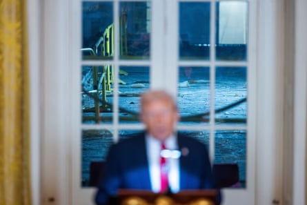 construction is seen behind a man speaking
