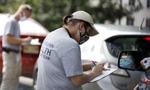 Members of the Mississippi Health Response Team take down medical information from people potentially affected by coronavirus at the Mississippi Legislature at the Capitol in Jackson on Monday, 6 July 2020.