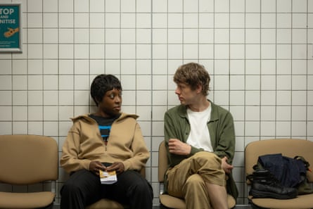 A man and a woman in a hospital waiting room.