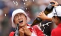 Amy Yang is doused with champagne by her fellow golfers after securing her first major title at the women’s PGA championship.
